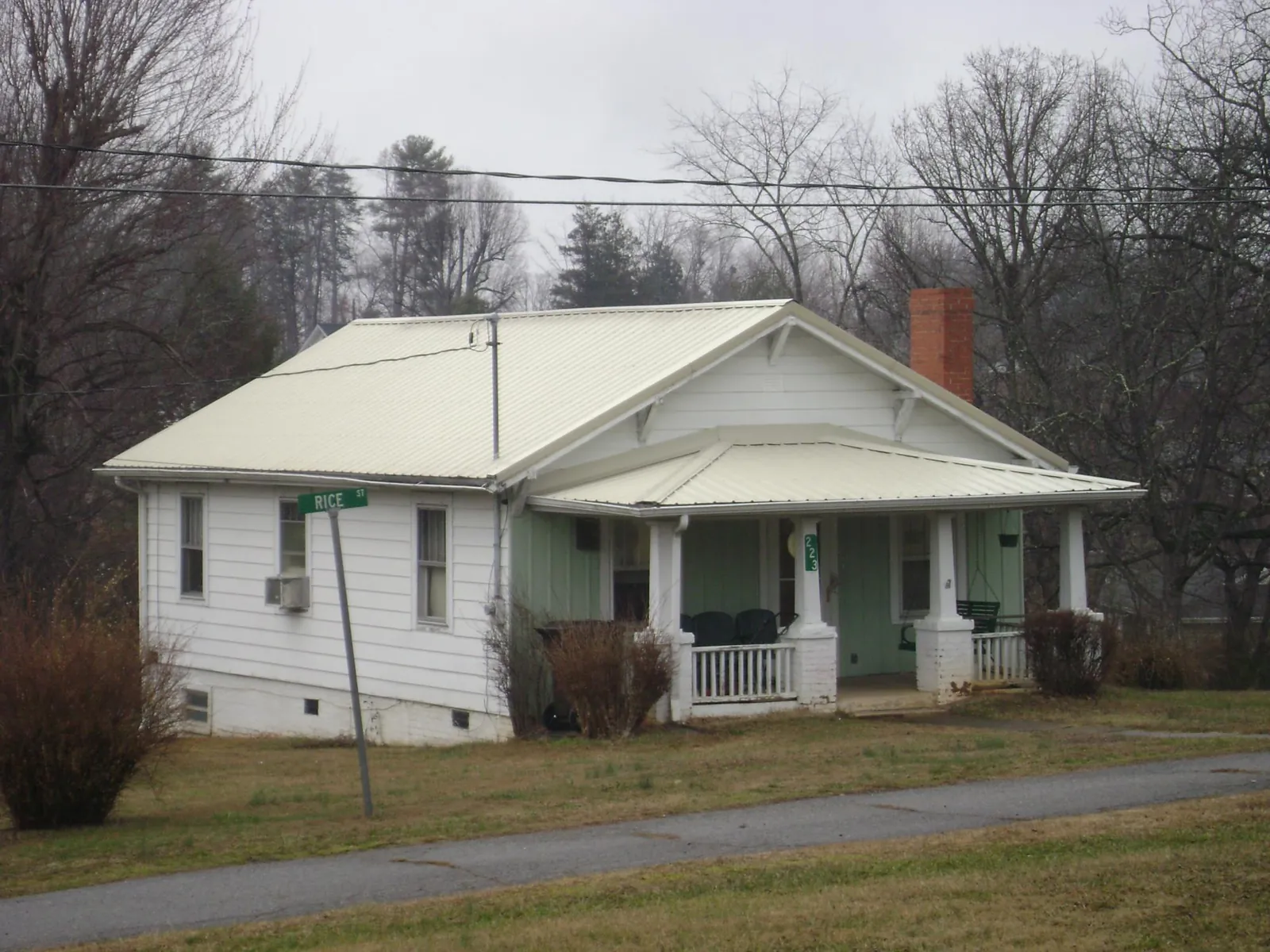 White metal roof on a craftsman bungalow at a street corner in Little York
